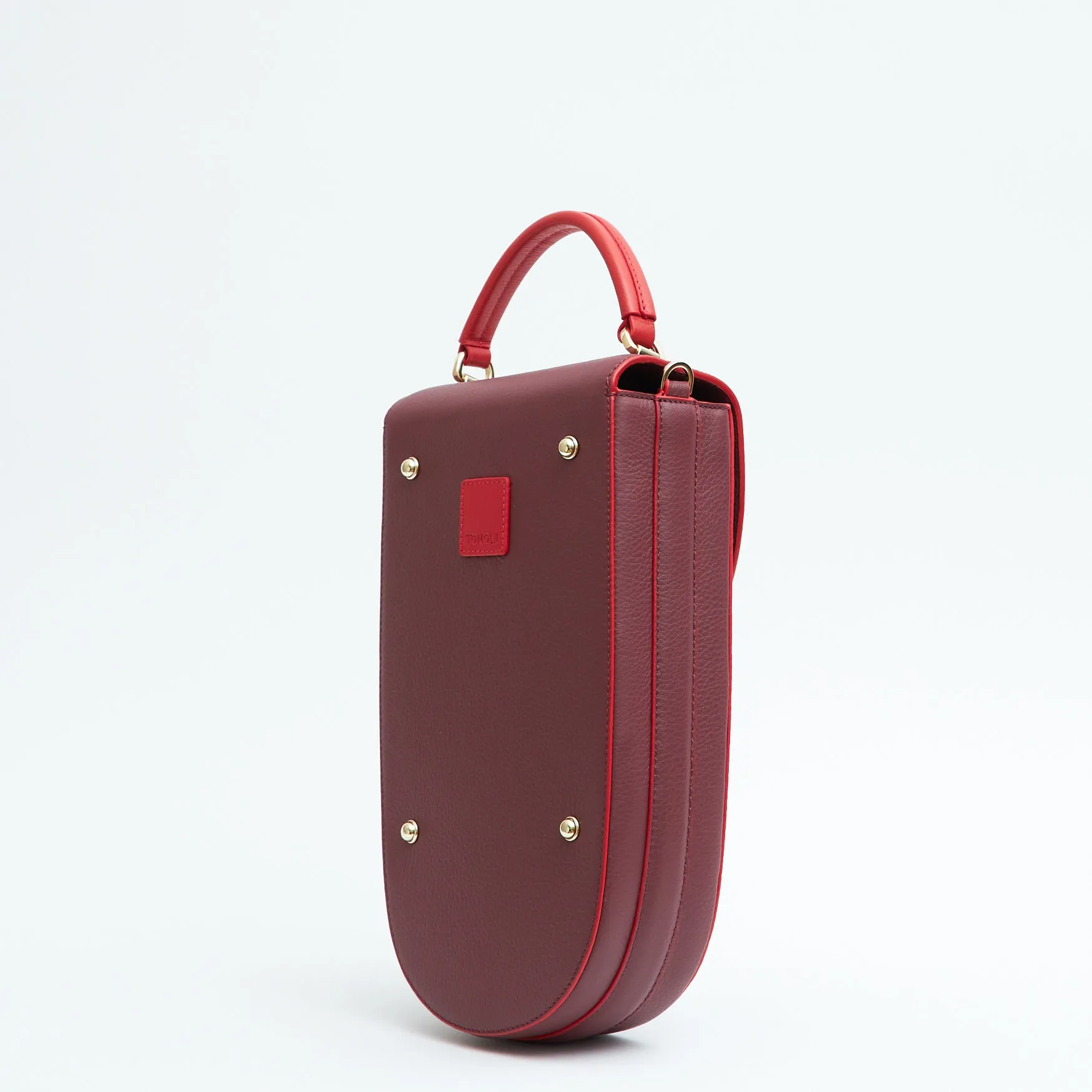 fitini II elongated structured saddle bag - hot sangria with gold